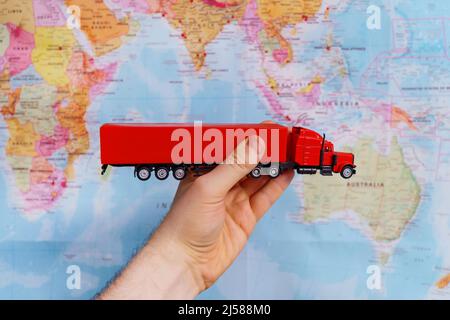 Trucking in Asia concept. Model truck toy over map. Stock Photo