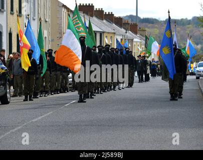 Masked men and women in paramilitary uniform at an Easter Monday Dissident Republican parade in Derry, Northern Ireland 18 March 2022. ©George Sweeney / Alamy Stock Photo Stock Photo