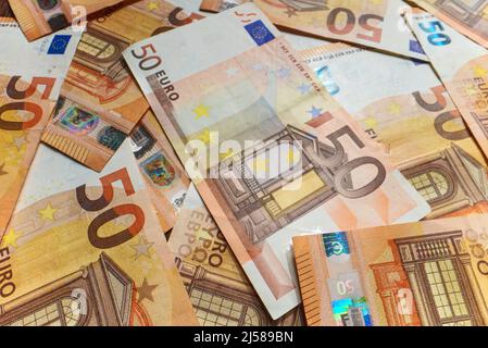 Lot of euro banknotes in denominations of fifty euros. Stock Photo