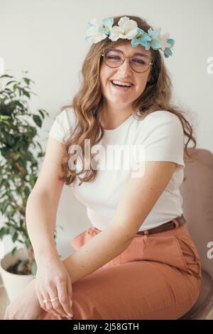 young artisanal artist wearing her handmade flower headband Stock Photo