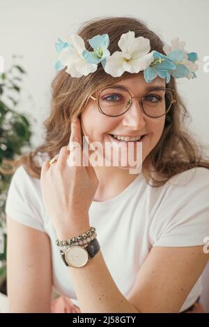 young artisanal artist wearing her handmade flower headband Stock Photo