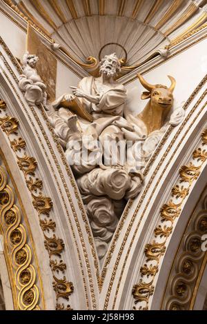 VALENCIA, SPAIN - FEBRUARY 14, 2022: The statue of St. Luke the Evangelist fom the cupola of the Cathedral by Josep Pujol from 18. cent. Stock Photo