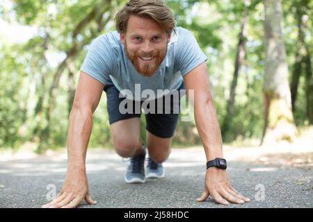 young sportsman is ready to run outdoors in the morning Stock Photo