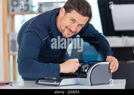 trying to repair the office printer Stock Photo