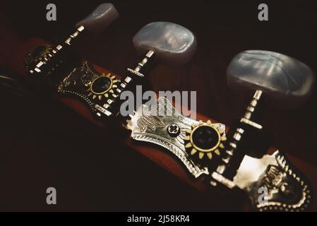 Guitar pegs on a six-string Spanish guitar. Stock Photo