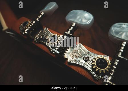Guitar pegs on a six-string Spanish guitar. Stock Photo