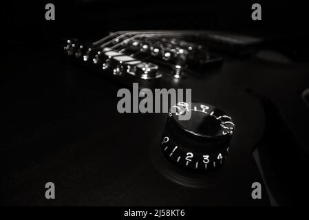 Volume control on six-string electric guitar. Stock Photo