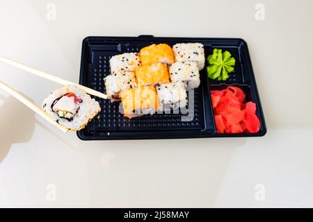 popular asian rolls lunch order to home online Stock Photo