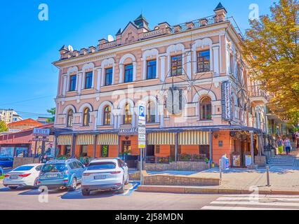 DNIPRO, UKRAINE - AUGUST 24, 2021: The scenic facade of historic building on Dmytro Yavornytsky Avenue, on August 24 in Dnipro Stock Photo