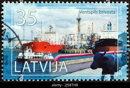 LATVIA - CIRCA 2012: A stamp printed in Latvia from the 'Latvian Ports' issue shows Ventspils, circa 2012. Stock Photo