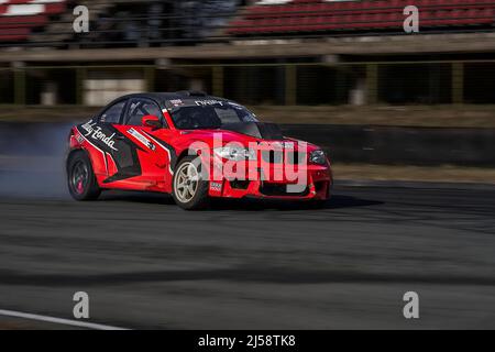 Car drifting, Blurred of image diffusion race drift car with lots of smoke  from burning tires on speed track Stock Photo