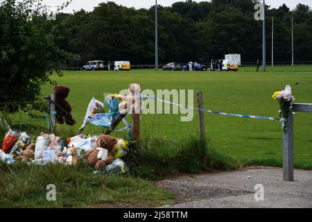 File photo dated 03/08/21 of tributes left at the scene in the Sarn area of Bridgend, south Wales, near to where five-year-old Logan Mwangi, also known as Logan Williamson, was discovered on July 31 2021. His mother Angharad Williamson, 31, his stepfather John Cole, 40 and a 14-year-old boy, who cannot be named for legal reasons, have been found guilty at Cardiff Crown Court. Issue date: Thursday April 21, 2022. Stock Photo