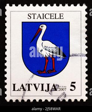 LATVIA - CIRCA 2007: A stamp printed in Latvia from the 'Coat of Arms' issue shows Staicele coat of arms, circa 2007. Stock Photo