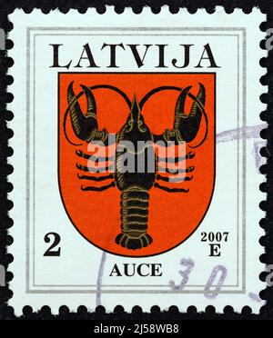 LATVIA - CIRCA 2007: A stamp printed in Latvia from the 'Coat of Arms' issue shows Auce coat of arms, circa 2007. Stock Photo