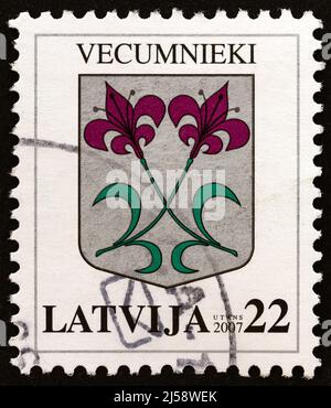 LATVIA - CIRCA 2007: A stamp printed in Latvia from the 'Coat of Arms' issue shows Coat of Arms of Vecumnieki, circa 2007. Stock Photo