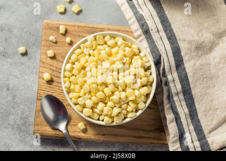 Organic Steamed White Sweetcorn Kernals in a Bowl Stock Photo