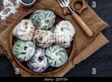 Chinese chives Dumplings Mixed Color or Garlic Chives Dim Sum Rice Cake inside with Taro Slice ,Bamboo shoot and Many kind of vegetable inside the flo Stock Photo