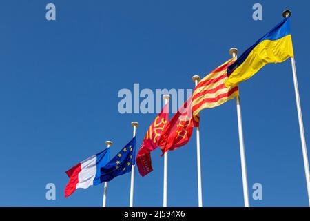 Ukrainian flag raised in front of the Hotel de Region in Montpellier as a sign of solidarity with the people. Occitania, France Stock Photo