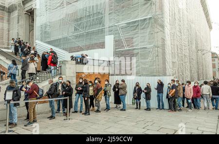 A long line of tourists people queued up to enter the Prado Museum. Madrid, Spain Stock Photo