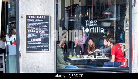 Pez Tortilla, tapas bar in Madrid, Spain. Scene behind the window of restaurant. Stock Photo
