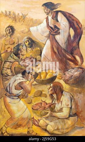 MONOPOLI, ITALY - MARCH 6, 2022: The painting Miralce The Feeding the multitudeof  in the church Chiesa di Sacro Cuore by Onofrio Bramante. Stock Photo