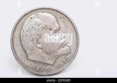 Obverse of a coin of the USSR with a portrait of the leader Lenin on a white background, close-up. Commemorative coin 1 ruble issued for the 100th ann Stock Photo