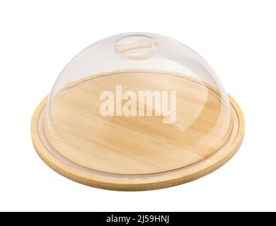 Round bamboo cutting board with clear plastic lid insulated on white background close-up Stock Photo