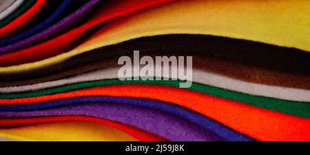 Several colored felt texture background. Assorted color felt fabric sheets, patchwork, sewing DIY craft Stock Photo
