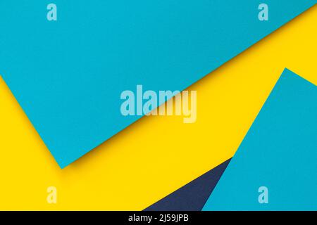 Abstract color papers geometry flat lay composition background with blue and yellow tones Stock Photo