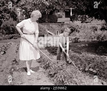 1960s TWO SENIOR OLDER WOMEN SITTING ON SOFA GOSSIPING Stock Photo - Alamy