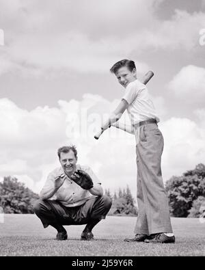 1940s KNEELING MAN FATHER ACTING AS CATCHER FOR TEEN BOY SON STANDING AT BAT PLAYING BASEBALL BOTH LOOKING AT CAMERA - j1465 HAR001 HARS FUTURE NOSTALGIA COACH BAT OLD FASHION 1 JUVENILE TEAMWORK COMPETITION ATHLETE SONS FAMILIES LIFESTYLE SATISFACTION RURAL HEALTHINESS HOME LIFE COPY SPACE FULL-LENGTH PERSONS INSPIRATION MALES TEENAGE BOY ATHLETIC ACTING FATHERS B&W GOALS KNEELING DREAMS HAPPINESS ADVENTURE BOTH CATCHER DADS EXCITEMENT LOW ANGLE RECREATION PRIDE AS AT OPPORTUNITY BATTING TEENAGED BALL GAME BALL SPORT COACHING COOPERATION GROWTH JUVENILES MID-ADULT MID-ADULT MAN PRE-TEEN Stock Photo