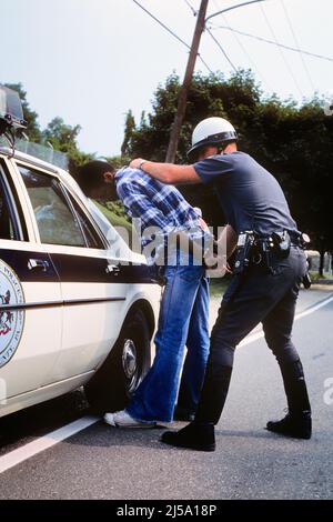 1970s FULL LENGTH POLICE OFFICER MAN POINTING GUN AT CAMERA ACTION ...