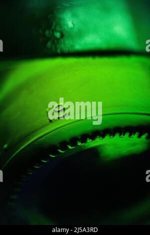 Green glass bottle detail. Stock Photo