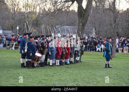 Lexington, United States of America. 18 April, 2022. Costumed historic actors playing the part of the Lexington Minutemen participate in a Patriots Day reenactment April 18, 2022 in Lexington, Massachusetts. Patriots Day is a special Massachusetts state holiday commemorating the opening battle of the American Revolutionary War on April 19, 1775. Credit: Mark Herlihy/US Air Force/Alamy Live News Stock Photo