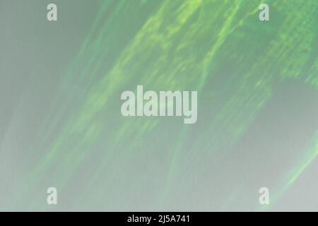 Diagonal rays of light on a gray background. Blurred abstract ...