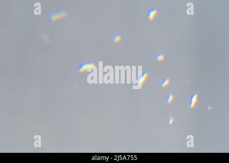 .Abstract prism reflection, rays leaking through lens effect. Crystal light reflections for overlay mockup on light background. Rainbow holographic Stock Photo