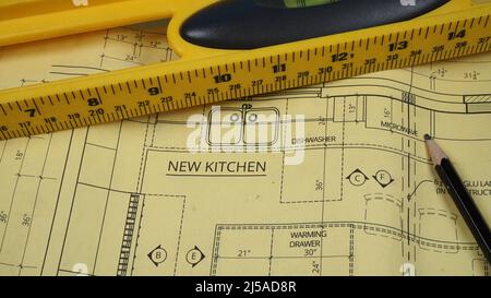 Blueprint for kitchen remodel along with pencil and level Stock Photo