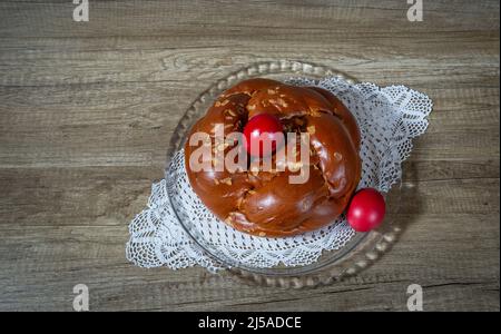 Easter traditional bread, greek tsoureki and red eggs Stock Photo
