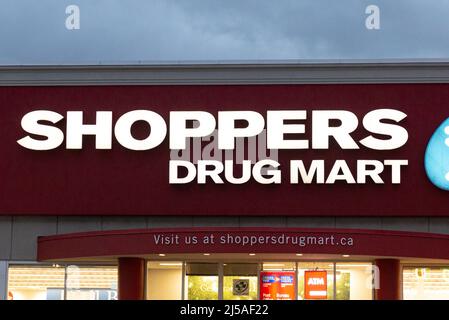 Toronto, ON, Canada - December 30, 2021: The logo and brand sign of Shoppers Drug Mart Store in Toronto, Canada. Shoppers Drug Mart is a corporation t Stock Photo