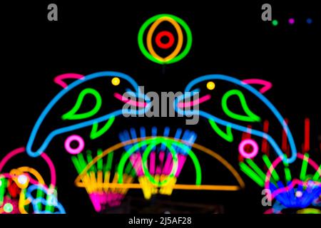 Blured Multi-colored neon lights at night. Stock Photo