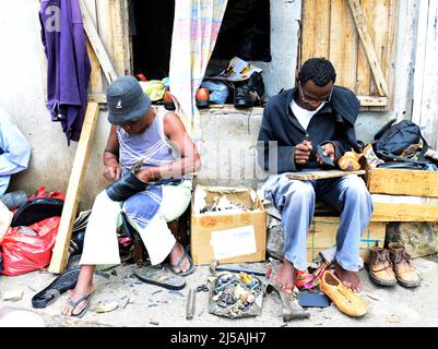 Malagasy cobbler in Antananarivo, Madagascar. Stock Photo