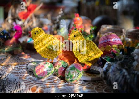 Yellow chickens and Easter eggs as decorations for Easter. Stock Photo