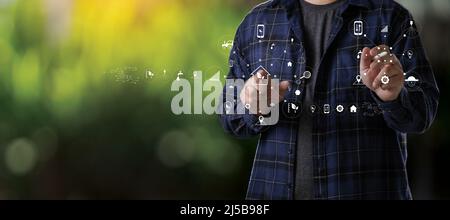 Agriculturist  Young farmers man using tablet computer analysis data check data network in the Internet vegetable background agricultural farm technol Stock Photo