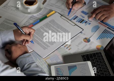 Businessman  working on laptop computer on desk document signing contract ERP Stock Photo