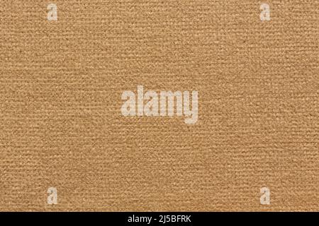 Textile background in simple light brown tone. Stock Photo