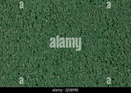 Darkened green foam EVA texture with porosity on surface. Stock Photo