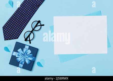 Father's day concept on blue background. Empty sheet of paper with space for text and copy space Stock Photo