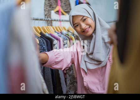 muslim woman shopping new dress for eid mubarak idul fitri Stock Photo Alamy