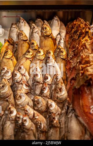 Fish shop: close-up of smoked and dried fish laid out in a shop window Stock Photo