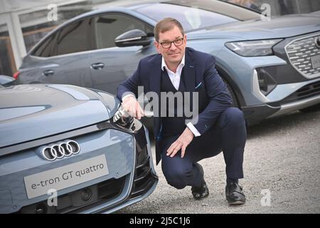 Tegernsee, Germany. 22nd Apr, 2022. Markus DUESMANN (Management Chairman of AUDI AG) poses at the front of an Audi e-tron gt quattro. Ludwig Erhard Summit 2022 at Gut Kaltenbrunn am Tegernsee on April 21, 2022. Credit: dpa picture alliance/Alamy Live News Stock Photo